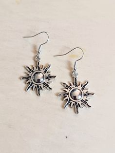 Silver sun dangling earrings with hypoallergenic and nickel free backs of your choice Summer Jewelry With Sun And Moon Design, Adjustable Sun Design Jewelry, Sterling Silver Earrings For Everyday Summer Wear, Nickel-free Sterling Silver Summer Jewelry, Sun And Moon Design Jewelry For Summer, Sun And Moon Design Jewelry As Summer Gift, Summer Gift Jewelry With Sun And Moon Design, Silver Jewelry For Everyday Summer Wear, Summer Sun Design Jewelry Gift