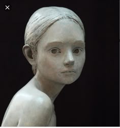 a statue of a woman with short hair