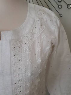 Soft cotton Chikankari kurta for women is an airy and lightweight companion for a hot summer day. Lucknow Chikan Kurti/Tunic /Kurta is one of the gorgeous attire for working from home.This beautiful Hand embroidered tunic, kurta is ideal for any functions/parties. If you want a classic look then pair it with leggings, skinny jeans.This is a contemporary reflection of traditional India Chikan embroidered ethics which had originated centuries ago in Lucknow.Chikankari being the exquisite needlewor White Anarkali Blouse For Eid, Eid Anarkali Style White Blouse, White Cutdana Blouse For Eid, Straight Kurta With Resham Embroidery In Loose Fit, Elegant White Chikankari Embroidery Blouse Piece, Festive Straight Kurta Tops With Cutdana, Wedding Anarkali Top With Chikankari Embroidery, White Blouse Piece For Eid, Anarkali Tops With Chikankari Embroidery For Weddings