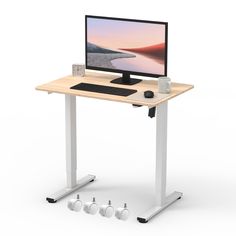 a computer desk with a monitor, keyboard and mouse next to it on a white background