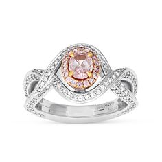 For the woman you adore, this sparkling diamond engagement ring proclaims her sophisticated style. Crafted in 99 platinum, this fashion-forward design showcases a shimmering oval cut fancy purplish-pink diamond wrapped in a rose gold pink diamond halo. The lovely diamond-lined twist shank lends a feminine appeal to the look. Set inside are beautifully equal cut pave diamonds for extra shine and dazzle. 
Available in all sizes, send us yours!
0.53 carat oval cut fancy purplish-pink diamond - Oval Cut Ring, Sparkling Diamond, Rose Gold Pink, Orange Sapphire, Fancy Diamonds, Tennis Bracelet Diamond, Salt And Pepper Diamond, Diamond Halo, Pink Diamond