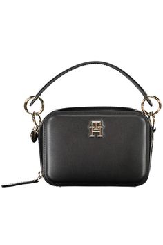 Elevate your accessory game with the sleek and sophisticated Tommy Hilfiger handbag. This versatile piece boasts a removable handle and chain shoulder strap, allowing you to switch up your style on-the-go. The bag features two compartments, a central pocket, and an internal card pocket—perfect for keeping your essentials organized. The striking contrasting details and prominent logo give this bag its distinctive Tommy flair, while the secure zip closure ensures your belongings stay safe. Tailore Tommy Hilfiger Handbags, Handbag Straps, Women Handbag, Black Chain, Tommy Hilfiger Women, Men's Backpack, Look Casual, Black Handbags, Leather Accessories