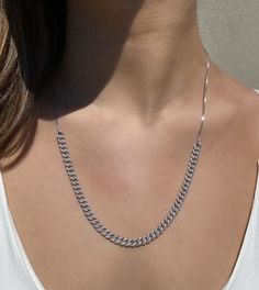 Make a subtle statement with our Curb Chain Link Necklace! We love it paired with a simple T and jeans...yet this style is glam enough to wear out with that perfect little black dress. What do we love about this curb link necklace? It is adjustable! Featured with a slider function, so you can wear it at any desired length. BONUS . . . not only can you wear it with the glitz side up but flip it over and wear it on the all metal side for a casual appearance. Rhodium plated sterling silver Handset Sterling Silver Curb Chain Necklace For Everyday, Everyday Sterling Silver Curb Chain Necklace, Silver Everyday Curb Chain Jewelry, Silver Curb Chain Jewelry For Everyday, Everyday Silver Curb Chain Jewelry, Trendy Silver Necklace With Box Chain, Silver Cuban Link Jewelry For Everyday, Everyday Silver Cuban Link Jewelry, Classic Silver Cuban Link Necklace For Everyday