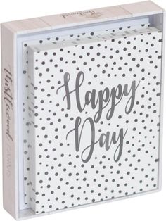 a white box with the words happy day on it