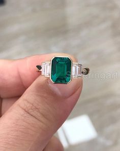 Huge Quality Octagon Emerald & Baguette Diamond Engagement Ring, Womens Gold Ring, May Birthstone Emerald, Thanksgiving Ring, Statement Ring Ring information: Main stone : Natural Emerald & Diamond  Metal type:  White Gold Stone Cut / Shape : Faceted / Octagon & Baguette Birthstone : May Month Metal stamp / Hallmarked : Yes Certificate : Yes This listing is only for one ring * Customization is always welcome and please feel free to contact with me if you have any design ideas! IMPORTANT: * Custo Fine Jewelry Emerald With Baguette Diamonds, White Gold Emerald Ring With Baguette Cut, Luxury Emerald Ring With Baguette Cut And Accent Stones, Rectangular Emerald Ring With Diamond Accent Stones, Octagon Emerald Ring With Diamond Accent Stones, Emerald Rings With Baguette Diamonds, Fine Jewelry With Baguette Diamonds And Emerald, Emerald Rings With Baguette Cut And Accent Stones, Fine Jewelry Emerald Ring With Baguette Cut