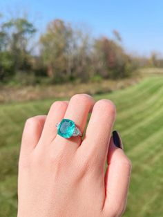 PARAIBA TOURMALINE Three Stone Classic Blue Vintage Ring, Magnificent Exotic Neon Blue/Vivid Glow Blue Color/ Glow Paraiba Blue Ring Mainstone size is 11x14mm ♥Ready to ship ♥ The main stone is the Finest Doublet PARAIBA TOURMALINE. ♥Absolutely gorgeous and beautifully handcrafted Finest Doublet PARAIBA TOURMALINE in an exquisite setting. ♥ This classic yet trendy Jewelry makes the perfect Christmas/Anniversary/Valentine's/Birthday gift for her that will be treasured forever. We have confidence Green Aquamarine Jewelry With Center Stone, Green Aquamarine Promise Ring, Blue Emerald Rings With Gemstone Accents, Luxury Green Aquamarine Jewelry, Green Aquamarine Ring With Center Stone, Gia Certified Aquamarine Jewelry Ring, Gia Certified Aquamarine Ring, Gia Certified Blue Rings, Emerald Green Earrings