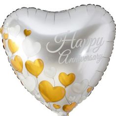 a heart shaped balloon with the words happy anniversary written on it and gold hearts floating in the air