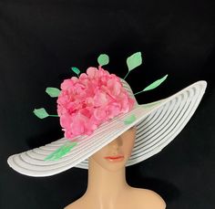 Gorgeous Kentucky Derby Ascot Hat              100% Brand New   Designed & Made in USA         Beautiful hand embellished wide brim hat adorned with green stripped coque rooster feathers and a large pink flower. Each flower is individually hand painted. Colors may differ slightly. This gorgeous hat has a 22.5 inches interior crown circumference.The Brim is 5 3/4 inches.It fits most!    Hat Base Color: White This is a high quality wide brim hat with wire which could hold it's shape.It won't flop in the eyes and face. And it will protect your face and hair from hot sun and wind. It's perfect for outdoor event. Would be great for Wedding, Bridal Shower, Tea Party, Concert,Evening Wear, Belmont,Ascot, Derby day,Races, Church, Art Photography,etc. ** This hat listing is currently Made to Order. High Crown Sun Hat For Spring Vacation, High Crown Hats For Spring, Whimsical Sun Hat With Curved Brim For Spring, Spring Garden Party Fedora Fascinator, High Crown Sun Hat For Spring Beach, High Crown Sun Hat For Beach In Spring, Spring Beach Sun Hat With High Crown, Brimmed Costume Hats For Beach And Spring, Brimmed Costume Hats For Beach In Spring