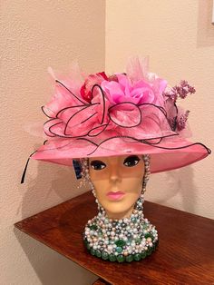 Pink shiny fabric ruffled derby style hat one size fits most adjustable. With pink sparkle tulle, assorted pink flowers and feathers , tinsel, one of a kind Flower Hats For Kentucky Derby Races, Kentucky Derby Floral Hats, Kentucky Derby Flower Hats, Handmade Flowers Hats For Kentucky Derby, Whimsical Hat For Kentucky Derby, Pink Costume Hats And Headpieces For Carnival Evening, One Size Kentucky Derby Fascinator Hat, Flower Hat For Kentucky Derby Party, Pink Top Hat For Church And Kentucky Derby