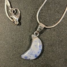 Sodalite Crescent Moon Chakra Pendant On 18" 925 Silver Plated Snake Chain. Sodalite Chakra Helps With Mental Clarity, Meditation, Self Awareness And Self Expression, Communication, And Brings Good Luck And Wealth. Sodalite Assist In Determining Your Life's Purpose And Direction In Life. It Integrates Logic And Intuition. Silver Crescent Gemstone Necklace, Blue Moonstone Necklaces With Moon Phase, Blue Moonstone Necklaces With Moon Phase Detail, Blue Moonstone Necklace In Moon Shape, Blue Moonstone Necklace With Moon Phase Detail, Silver Moon-shaped Crystal Necklaces With Gemstone, Silver Moon-shaped Crystal Necklace With Gemstone, Sterling Silver Pendant Crystal Necklace With Moon Charm, Blue Moonstone Celestial Necklace