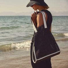 Raffia Tote in Black Sea | James Perse Los Angeles Luxury Summer Bag With Leather Trim, Chic Vacation Shoulder Bag With Leather Trim, Chic Shoulder Bag With Leather Trim For Vacation, Summer Shopping Bag With Leather Trim, Chic Straw Tote Bag With Leather Trim, Modern Summer Bags With Leather Trim, Chic Straw Bag With Leather Trim And Double Handle, Summer Beach Straw Bag With Leather Trim, Luxury Black Straw Bag For Summer