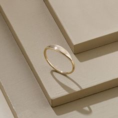 The Tiny Signet Ring is the pinnacle of minimalist design and elegant rings. Its plainness with glamorous modesty will fascinate people around you. It is perfect for everyday use and ring stacking. - Made in 14k Solid Gold - Band Width: 1.26 mm / 0.04 inches- Top Width: 3.30 mm / 0.12 inches- Thickness: 1.06 mm / 0.04 inches - This product comes with iconic Norm Jewels gift box Minimalist Stackable Diamond Ring With Open Band, Minimalist Open Band Stackable Diamond Ring, Minimalist Engraved Ring With Polished Finish, Modern 14k Gold Stackable Rings, Modern 14k Gold Stackable Rings With Round Band, Modern Everyday Stackable Rings With Round Band, Modern 14k Gold Stackable Round Band Rings, Everyday Initial Ring With Simple Round Band, Minimalist 14k Gold Dome Ring For Wedding