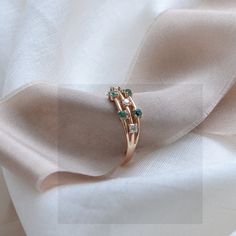 Make your day with our emerald & diamond ring! It's perfect for an engagement ring, wedding or anniversary ring. Natural emerald engagement ring is made of solid gold in a unique and delicate style. Choose your color of gold and ring size from the drop down menu. If you are looking to make this piece even more custom and special, feel free to contact me! We will find a way to make something specially for you.✨ DIAMOND DETAILS QUANTITY 3ps MEASUREMENTS 2.5mm CLARITY GRADE SI COLOR GRADE G GEM Green 14k Gold Diamond Promise Ring, Green Diamond Promise Ring In 14k Gold, Green Emerald Ring With Rose Cut Diamonds For Anniversary, Elegant Green Emerald Cut Stackable Rings, Rose Gold Emerald Ring For May Birthstone, Anniversary Green Emerald Ring With Rose Cut Diamonds, Green Diamond Birthstone Ring For Promise, Green Diamond Ring In 14k Gold For Anniversary, Green 14k Gold Diamond Ring For Anniversary