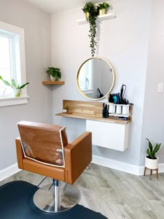 a chair sitting in front of a mirror on top of a wooden table