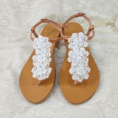 Beach wedding sandals - Greek leather - White flower lace decorated sandals -Bridal party shoes- White flats- Bridal party shoes -Beach wedding       This pair is made of genuine Greek leather and is decorated with three lace flowers with pearls. Elegant leather sandals, a must have accessory for the summer. It's a great gift for a bride or your bridesmaids. They could be perfect for any woman who wants to make a difference & wear something special every day. *All sandals are made of Genuine Gre Bridal Shoes Lace, Shoes Beach Wedding, Flower Wedding Shoes, Bridal Party Shoes, Beach Wedding Party, Beach Wedding Sandals, Sandals Greek, Eyeglass Necklace, Wedding Sandals