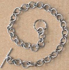 Antiqued Sterling silver fancy link bracelet with toggle clasp 71/2 inchesLinks size:4X6mm Toggle size:10mm round X 12.5mm long Classic Metal Charm Bracelet With Sterling Silver Clasp, Metal Chain Link Jewelry With Toggle Clasp, Nickel Free Silver Oval Link Charm Bracelet, Silver Link Charm Bracelet With Sterling Clasp, Silver Elegant Toggle Necklace For Jewelry Making, Nickel-free Silver Oval Link Charm Bracelet, Silver Nickel-free Oval Link Charm Bracelet, Metal Toggle Necklace, Silver Chain Link Charm Bracelet With Lobster Clasp