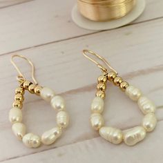 "Teardrop Pearl Earrings  These beautiful earrings were specially designed to complement the outfit of a woman and give her a look very chic and elegant. They are lightweight and very comfortable for all day wearing, made with gold plated wire, gold plated beads and freshwater pearls in a beautiful teardrop shape. They are a fantastic option as a bridesmaid gift and a really cute pearl bridal jewelry piece.  If you buy this unique and wonderful piece, you will feel the love that I feel when I'm Everyday Teardrop Pearl Pendant Earrings, Everyday Teardrop Earrings With Pearl Charm, Pearl White Teardrop Pearl Charm Earrings, Delicate Teardrop Pearl Earrings For Pierced Ears, Everyday Teardrop Pearl Earrings, Teardrop Pearl Pendant Earrings, Pearl White Dangle Teardrop Earrings, Pearl White Dangle Teardrop Pearl Earrings, Pearl White Teardrop Dangle Earrings