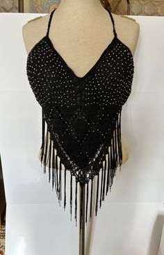 Fabulous and fun club wear belly dancing disco halter. A bit of stretch with lining and molded cups, fits small to large. Excellent condition, appears to be missing 3 or 4 rhinestones, not noticeable. Black Stretch Halter Top For Festivals, Fitted Bohemian Halter Top For Party, Beach Fitted Sequined Crop Top, Beach Sequin Fitted Crop Top, Stretch Backless Halter Top For Festival, Bohemian Stretch Halter Top For Party, Sequined Fitted Crop Top For Beach, Black Bohemian Halter Top For Party, Bohemian Halter Neck Tops For Party