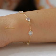 Rainbow Moonstone Bracelet/ 18k Yellow Gold Bracelet/ Gold Chain Bracelet/ Blue Flashy Moonstone/ Moonstone Bracelet/  Valentine Day Gifts  GEMSTONE DETAILS  ✦ Gemstone : Rainbow Moonstone  ✦ Gemstone Type : Natural ✦ Gemstone Shape : Oval ✦ Gemstone Color : As images ✦ Gemstone Cut :  Oval ✦ Number of Gemstones: 1 ✦ Gemstone Grade: Excellent ✦ Gemstone Weight : 1.11 CT METAL DETAILS  ✦ Metal : 18K Gold ✦ Metal Color : Yellow Gold/White Gold/Rose Gold ✦ Bracelet Size : 7.5 Inch  ✦ Total Weight : 2.1 Gram ✦ Bracelet Box : Yes CUSTOMISATION DETAILS  We can customize any piece of fine jewelry. You can simply message us on Etsy or drop a text at +91-7357229656 (WhatsApp/I Message) to let us know about all the customization you want. Customization can include  ✦ The Gemstone: This ring can be m Gemstone Moonstone Bracelets, Moonstone Wedding Bracelet, Elegant Round Moonstone Crystal Bracelet, Dainty Round Moonstone Bracelets, Elegant Moonstone Gemstone Bracelets, Gold Bracelet Moonstone, Gold Moonstone Bracelet With Gemstones, Gold Moonstone Bracelet, Adjustable Moonstone Gemstone Bracelet