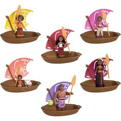 the figurines are sitting on small trays with paddles and umbrellas