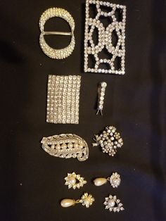 Nice eclectic lot of vintage jewelry and embellishments that include: 4 rhinestone and pearl pendants, 1 beautiful small brooch, 1 single shoe clip (1.5"x2"), 1 small barrette (1.25" long), 1 sash buckle and 1 sew-on belt embellishment (3" x1.75"). All rhinestones intact. The leaf brooch shown in the photo has been removed. I lowered the price to reflect the change. Leaf Brooch, Shoe Clips, The Change, Pearl Pendant, Jewelry Sets, Embellishments, Vintage Jewelry, Buckle, 10 Things