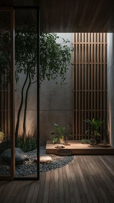 a room with wooden flooring and plants in it