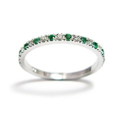 "This elegant 14K gold half eternity ring set with a line of alternating green emeralds and sparkling white diamonds, and has a high polished glare. Celebrate your wedding day or her May birthday with this lovely anniversary band that will be treasured for a lifetime. This Emerald diamond wedding ring is a symbol of endless love, and it will serve you as a memory of your promise to love each other forever. Customization: * You can order this ring in different shades of gold - 14k/18k white gold, Green Diamond Eternity Band With Prong Setting, Green Diamond Birthstone Ring With Round Band, Elegant Green Stackable Rings With Half Eternity, Elegant Green Stackable Half Eternity Rings, Green Half Eternity Ring For Anniversary, Green Diamond Half Eternity Ring, Green Half-eternity Ring For Anniversary, Elegant Green Eternity Band For May Birthstone, Green Diamond Half Eternity Ring For Anniversary