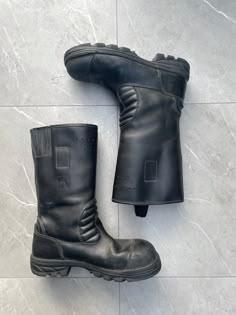 1960s Vintage Fireman Boots  Color: Black  ⌖ Heavy-duty leather ⌖ shaft seams ⌖ Safety steel toe ⌖ leather ankle padding ⌖ Heat-resistant, slip-resistant Nitrile rubber ⌖ shell outsole with air chamber damping ⌖ Pull-on loops ⌖ Height: 13″ Please note all items are examined to the best of our ability. Most items are 20+ years old and are not in perfect condition small imperfections are to be expected any major flaws will be disclosed. Leather Combat Boots With Protective Design For Streetwear, Leather Combat Work Boots With Round Toe, Combat Leather Work Boots With Round Toe, Leather Steel Toe Work Boots For Streetwear, Combat Style Waterproof Leather Boots With Steel Toe, Vintage Steel Toe Work Boots, Combat Style Leather Waterproof Boots With Vibram Sole, Combat Leather Boots With Vibram Sole, Leather Combat Waterproof Boots With Vibram Sole