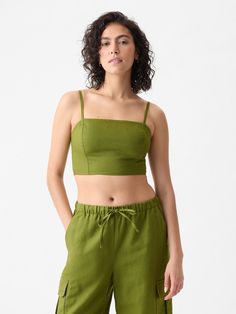 Soft linen-cotton blend ultra-cropped tube top.  Square neck.  Adjustable, removable spaghetti straps.  Smocked back.  * Fit: Slightly fitted.  Sits close to the body.  Ultra cropped, hits at the waist.  Note: Tyla is wearing a Gap Casual Cropped Tube Top With Built-in Bra, Casual Tube Top With Built-in Bra, Green Crop Top With Built-in Bra For Summer, Cotton Cami Crop Top With Built-in Bra, Fitted Cropped Top By Gap, Bandeau Crop Top With Built-in Bra For Day Out, Day Out Bandeau Crop Top With Built-in Bra, Gap Cropped Tops For Spring, Trendy Gap Tank Top For Summer