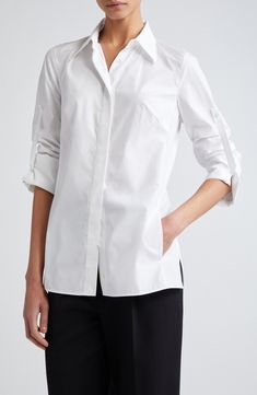 Silk-softened cotton poplin brings elegant ease to this button-up tunic designed with roll-tab cuffs, a point collar and martingale for an array of looks and fits. 28" front length; 29 1/2" back length (size 8) Hidden-button placket Point collar Long sleeves with roll-tab cuffs Martingale 78% cotton, 22% silk Dry clean Imported Designer Clothing Modern Blouse With Button Cuffs And Spread Collar, Modern Blouse With Buttons, Modern Blouse With Spread Collar For Daywear, Modern Blouse With Buttons For Daywear, Timeless Cotton Blouse With Button Cuffs, Designer Button-up Blouse For Office, Timeless Office Shirt For Spring, Modern Workwear Blouse With Placket, Spring Workwear Blouse With Open Cuff