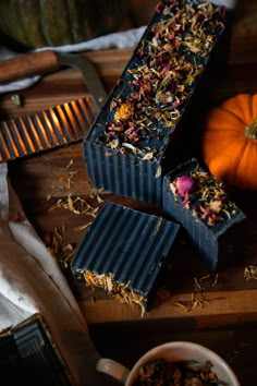 some kind of bar sitting on top of a wooden table next to a cup of tea