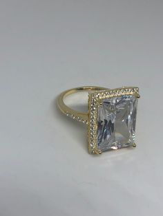 Hand made vintage filigree ring All pave set Cubic Zirconia in gold finished Sterling Silver My jeweler can re size for a $10-$20 fee All rings are shipped free in the US in a nice gift box. Check out our over a THOUSAND great reviews Engraving is $4 per letter and is not always perfect depending on the piece. It can take a few days if the jeweler is busy. This is payable to Paypal Judithsltd@gmail.com Gold Rings With Pave Setting For Party, Gold Diamond Crystal Ring For Party, Gold Crystal Ring For Party, Fine Jewelry, Gold Crystal Ring With Diamond Accents For Party, Gold Emerald-cut Crystal Ring With Center Stone, Gold Emerald Cut Crystal Ring With Center Stone, Dazzling Gold Diamond Ring For Party, Gold Crystal Ring With Halo Setting For Anniversary, Gold Diamond Ring With Prong Setting For Party