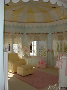 a baby's room decorated in pastel colors with pink and yellow accessories, including a crib