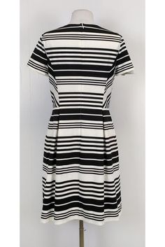 Be bold in stripes with this darling dress! Perfect for day time wear, you can style it with red accessories and chic flats. Size 10 67% polyester, 28% viscose, 5% spandex Made in U.S.A Rounded neckline Short sleeve Back zipper Lined Fitted at waist As is: Undone seam on right sleeve Bust 34.5" Waist 30" Shoulder to hem 37" Chic Striped Dresses For Day Out, Fitted Dresses With Vertical Stripes For Work, Fitted Midi Dresses With Vertical Stripes, Elegant Striped A-line Midi Dress, Classic Striped Summer Dress, Fitted Summer Dress With Vertical Stripes, Fitted Knee-length Dress With Vertical Stripes, Elegant Fitted Midi Dress With Vertical Stripes, Striped Fitted Knee-length Dress