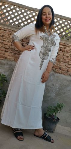 this stunning embroidered Moroccan kaftan is beautifully handcrafted by high skilled artisans from Morocco . both embroidery and beading are handmade . the fabric is so soft and comfy what makes it comfortable and elegant at the same time. this moroccan dress is easy to wear and will turn heads at any occasion, weddings, eid, baby shower, Ramadan ..etc *Product Describe Dress Style : kaftan THANK YOU VISIT AGAIN Bohemian Floor-length Kurta With Zari Work, Bohemian Floor-length Zari Work Kurta, Bollywood Style Maxi Length Kaftan With Zari Work, Bohemian Style Embellished Maxi Kurta, Bohemian Embellished Maxi Kurta, Elegant White Straight Kurta Kaftan, Bollywood Style Maxi Kaftan With Resham Embroidery, Bollywood Style Resham Embroidered Maxi Kaftan, Bollywood Style Resham Embroidery Maxi Kaftan