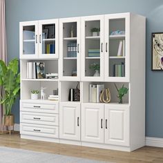 a white bookcase with lots of books on it