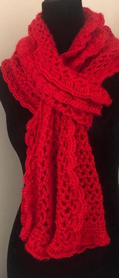 a red knitted scarf on a mannequin