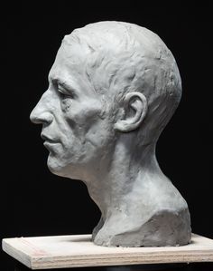 a sculpture of a man's head is shown