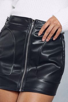 Sleek faux leather finish with high-waisted fit 
 Flattering panelled construction shapes the figure 
 Versatile micro length transitions from day to night 
This faux leather mini skirt from Misspap is an edgy wardrobe essential. With its body-hugging fit, it flatters your silhouette, while the high waist cinches you in. The smooth leather-look texture and asymmetric zip detailing add interest. Pair this skirt with a jumper and boots for a casual daytime look. For nighttime, match it with heels and a cami top to show off its versatile styling. With its straight hem and panelled construction that skims in all the right places, this micro mini transitions effortlessly from day to casual nighttime events. Rhinestone Skirt, Mini Skirt Black, Faux Leather Mini Skirt, Micro Mini Skirt, Ruched Skirt, Leather Mini Skirt, Tall Clothing, Faux Leather Skirt, Body Con Skirt