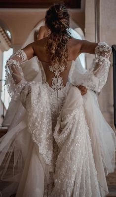 the back of a woman in a wedding dress