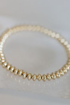 handcrafted stretch bracelet made with 14k gold filled 6mm disc beads made by artists in the USA Length - 6.5 inches Gold Round Beaded Bracelets Tarnish Resistant, Flexible Gold Beaded Stretch Bracelet, Classic Gold Beaded Stretch Bracelet, 14k Gold-filled Beaded Bracelets With Round Gold Beads, Gold Stretch Bracelet With 14k Gold-filled Beads, Gold Bracelet Simple, Gold Bracelets Stacked, Disc Bracelet, Gold Bracelet Set