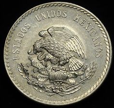 an old mexican silver coin with the eagle on it's back and words written in spanish