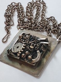 "Vintage Brutalist Silver K-J.B. Denmark Necklace Fabulous vintage Brutalist design, a silver plate necklace with unusual and daring Brutalist design Big and chunky Good condition, does have some ag patina Signed Design K-J.B. Denmark The chain measures about 36\" end to end, the pendant measures about 2.25\" Very different and fun piece Thanks For Shopping" Brutalist Metal Necklace With Oxidized Finish, Brutalist Pendant Jewelry Gift, Brutalist Sterling Silver Pendant Necklace, Brutalist Pendant Necklace For Gift, Silver Brutalist Necklace For Gift, Brutalist Silver Necklace For Gift, Silver Brutalist Necklace As Gift, Sterling Silver Brutalist Necklace For Gift, Antique Sterling Silver Necklaces With Lost Wax Casting