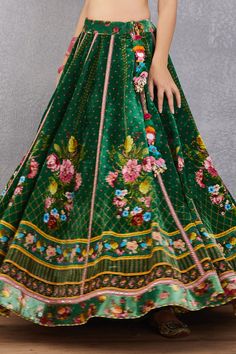 Emerald green lehenga with multi-color floral motif print, striped pattern and kamar tassel detail. Comes with plunging neck blouse and fringe border dupatta.
Component: 3
Printed
Neckline: Sweetheart
Sleeve Length: Cap
Fabric: Blouse and Lehenga: Velvet, Cotton Silk; Lehenga: Dupion; Dupatta: Net and Cotton Silk
Color: Green
Kamar latkans
Tie-up back
Fringe dupatta - Aza Fashions Fringe Dupatta, Emerald Green Lehenga, Lehenga Velvet, Velvet Embroidery, Green Lehenga, Plunging Neck, Bridal Lehengas, Silk Lehenga, Green Blouse