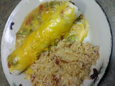 a white plate topped with rice and two different types of food