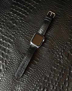 Meet our full grain classy black genuine leather watch strap. It is made of natural cow leather with crocodile embossed pattern. Due to the natural variations in the leather, no two are exactly alike bands! The leather has amazing texture without thorns which imitates a real skin of gator. the texture of the leather is almost 1:1 in appearance with natural crocodile, so the strap looks very expensive and presentable.  Distinctive skin texture, laconic black color, unique and attractive appearance make for a striking image. Our meticulously crafted bands with hand-painted edges and fine stitching bands are designed to add a touch of sophistication to any Apple Watch. Perfect Gift for Man, Father's Day Gift, Gift for Him. Compatible for: - all Apple Watch Series: 1, 2, 3, 4, 5, 6, 7, 8, 9, S Real Skin, Alligator Print, Embossed Pattern, Apple Watch Bands Leather, Leather Watch Strap, Apple Watch Strap, Skin Texture, Apple Watch Series, Leather Band