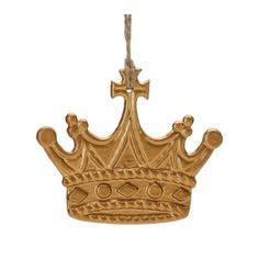 a gold crown ornament hanging from a rope on a white background with clippings