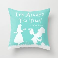 a pillow with the words it's always tea time and silhouettes of people