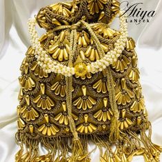 Beautifully Handcrafted Beaded Handbag Made From Satin Crepe. Designer Bucket Bag As Gift, Designer Gold Tote Box Bag, Designer Gold Pouch Shoulder Bag, Designer Gold Rectangular Bucket Bag, Luxury Handheld Gift Bag, Designer Gold Satchel Bag, Designer Gold Bucket Shoulder Bag, Luxury Beaded Bags For Everyday Use, Luxury Embroidered Festive Bag