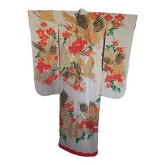 Vintage brocade Japanese ceremonial kimono a vintage Mid-Century ivory color collectible Japanese ceremonial kimono. One of a kind hand crafted work of art.  Fabulous museum quality ceremonial piece in pure silk with intricate detailed hand-embroidery throughout accented with floral heavy embroidery lame threads work that depicts, Birds, flowers, with designs in heavy gold threads, red and gold and black accents, all of them traditional symbols of prosperity and auspiciousness.   Opt for a uniqu White Long Vintage Kimono, Long White Vintage Kimono, Ceremonial Silk Kimono With Kimono Sleeves, Cream Silk Kimono For Wedding, White Long Silk Kimono, Traditional Gold Ceremonial Kimono, Traditional Embroidered Kimono For Tea Ceremony, Ceremonial Vintage Kimono, Traditional White Kimono For Wedding